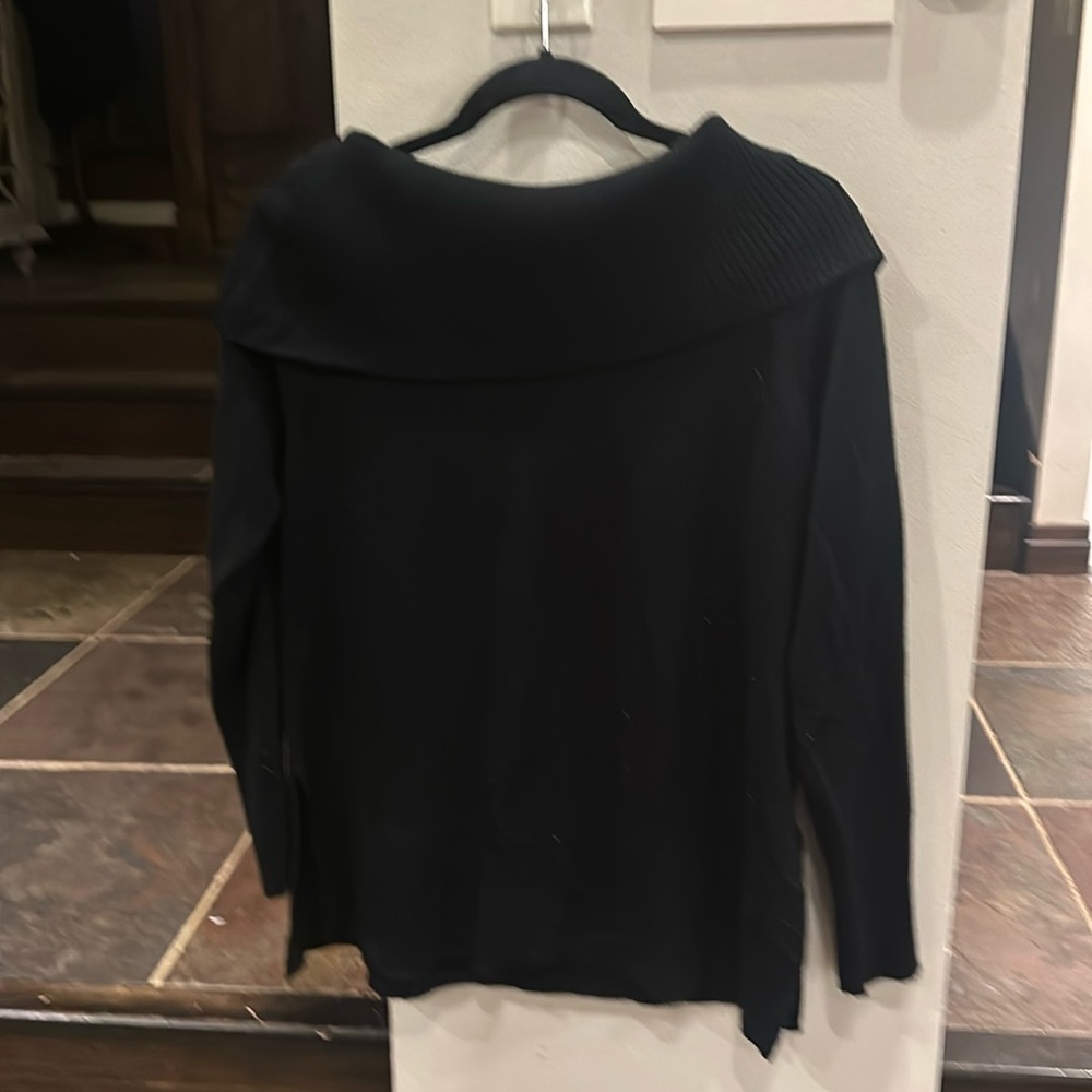Nicely shaped black sweater, beautiful turtleneck over the shoulder